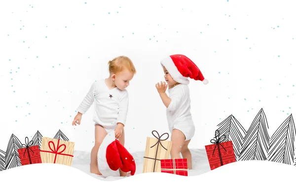 Toddlers with santa hats — Stock Photo