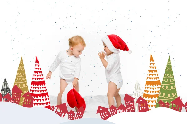 Малюки з капелюхами Санта — стокове фото