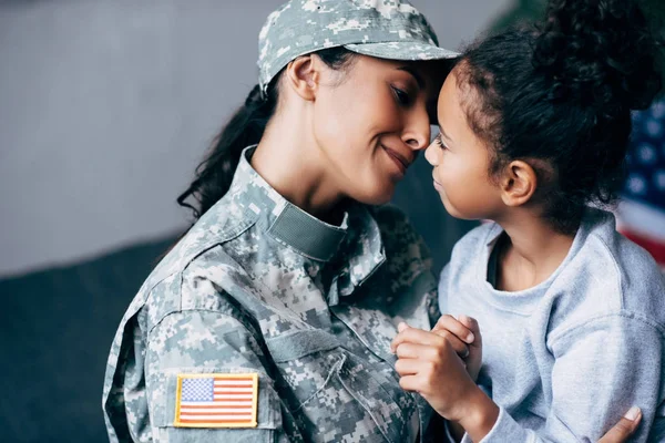 Mother in military uniform and daughter — Stock Photo