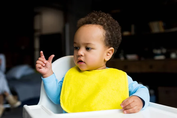 Little african american boy in bib — Stock Photo