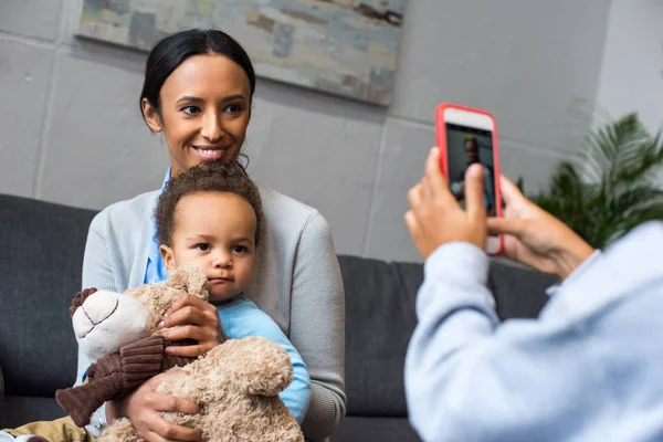 Taking photo of mother and son — Stock Photo