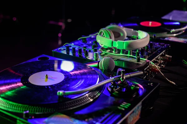 Sound mixer with vinyl and headphones — Stock Photo