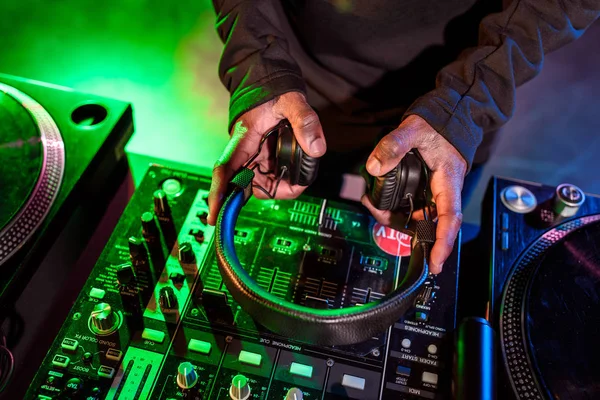 Headphones over sound mixer — Stock Photo