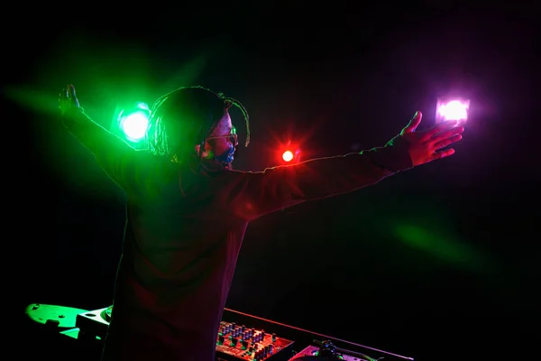 Club DJ with sound mixer — Stock Photo