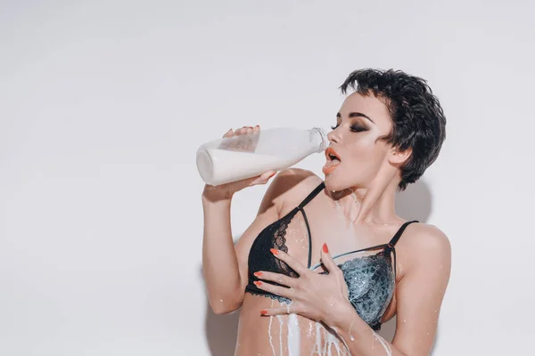 Sexy girl with milk — Stock Photo