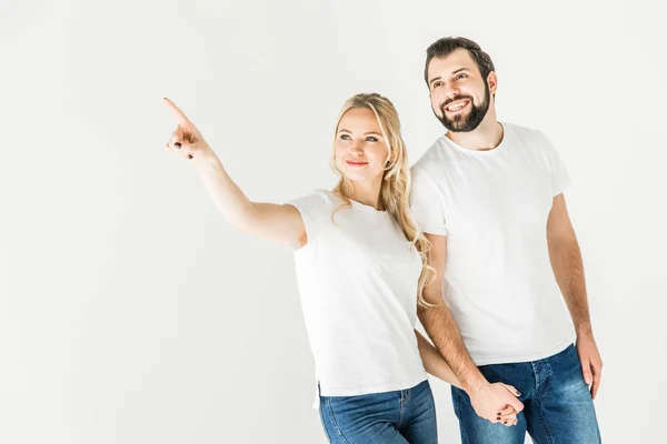Couple pointing away with finger — Stock Photo