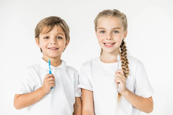 Kids with toothbrushes — Stock Photo