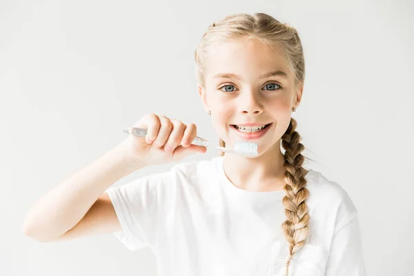 Criança segurando escova de dentes — Fotografia de Stock