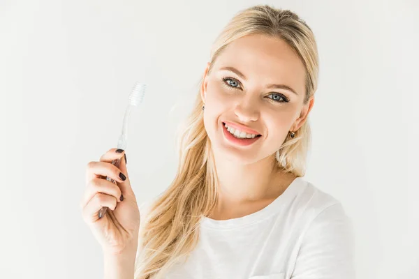 Mujer joven con cepillo de dientes — Stock Photo