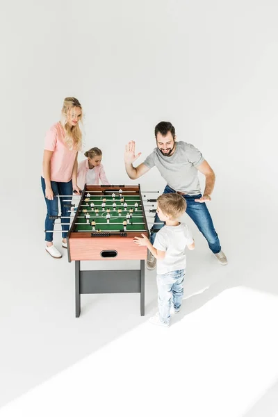 Family playing foosball — Stock Photo