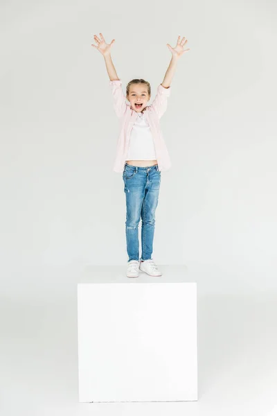 Child raising hands — Stock Photo