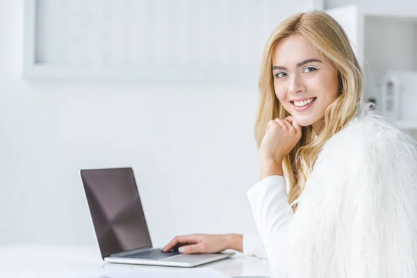 Businesswoman using laptop — Stock Photo