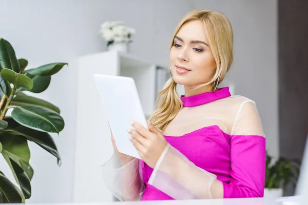 Businesswoman working with digital tablet — Stock Photo