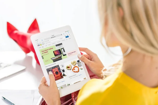 Woman using tablet with ebay — Stock Photo