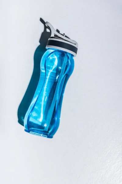 Top view of sports bottle with water on grey — Stock Photo