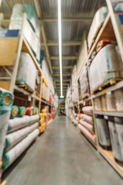 Blurred view of shelves with boxes in storehouse — Stock Photo