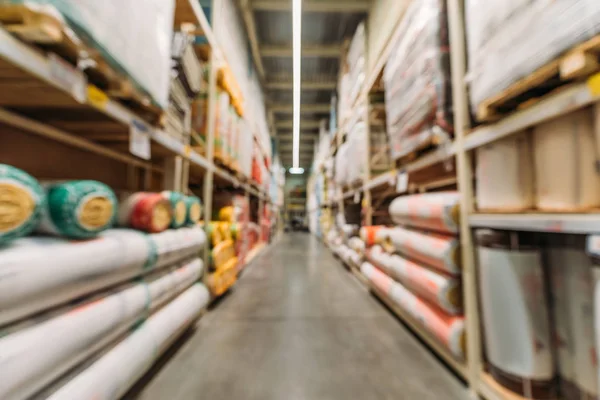 Blurred view of shelves with boxes in storage — Stock Photo