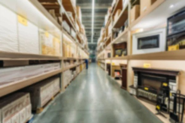 Blurred view of shelves with boxes in shipping stock — Stock Photo