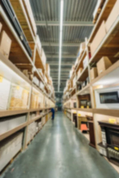 Blurred view of shelves with boxes in shipping stock — Stock Photo