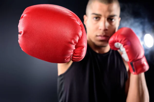 Handsome african american boxer making hit on black — Stock Photo