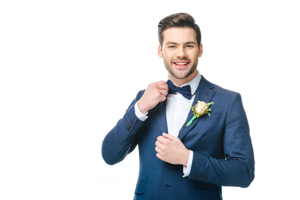 Portrait of young handsome groom in suit isolated on white — Stock Photo