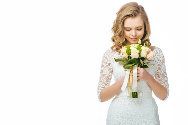 Portrait of young bride with wedding bouquet in hands isolated on white — Stock Photo