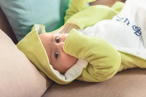 Selective focus of cute baby looking at camera — Stock Photo