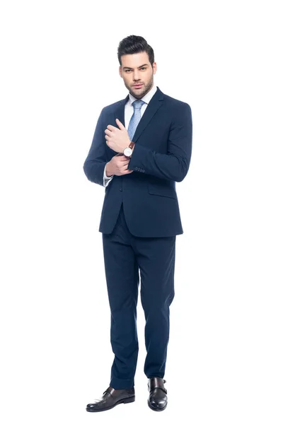 Elegante hombre de negocios posando en traje, aislado en blanco - foto de stock