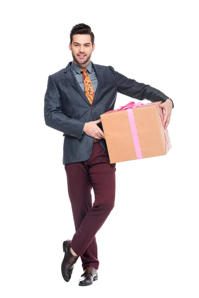 Handsome beardman holding gift box, isolated on white — Stock Photo