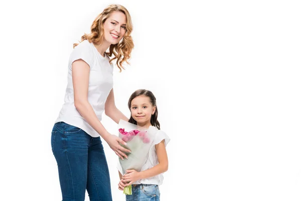 Portrait of happy mother and little daughter with bouquet of flowers isolated on white, mothers day concept — Stock Photo