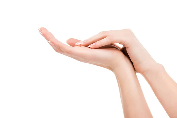 Partial view of hands with natural manicure, isolated on white — Stock Photo