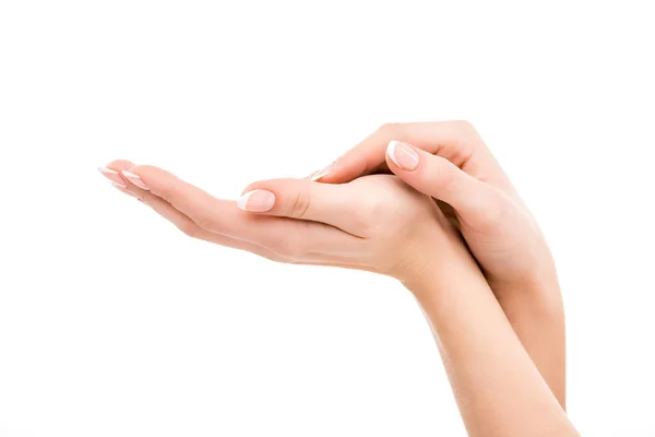 Vista cortada de mãos com manicure natural, isolado em branco — Fotografia de Stock