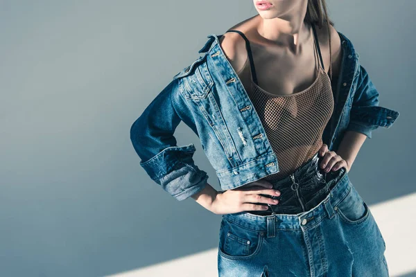 Cropped view of fashionable model in denim style — Stock Photo