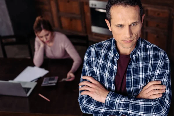 Selective focus of pensive man and upset woman in kitchen at home, financial problems concept — Stock Photo