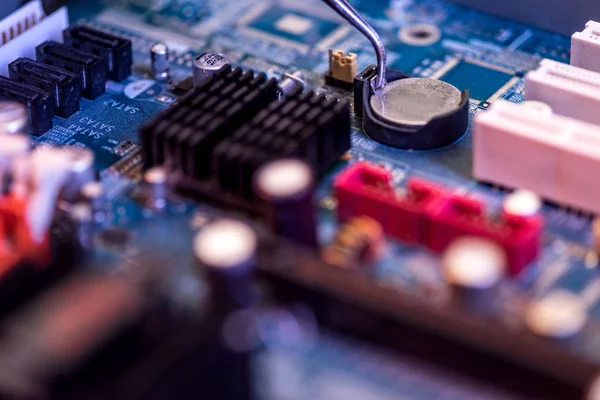 Close up of motherboard and battery in socket — Stock Photo