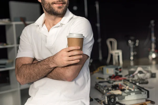 Cropped image of man holding cup of coffee — Stock Photo