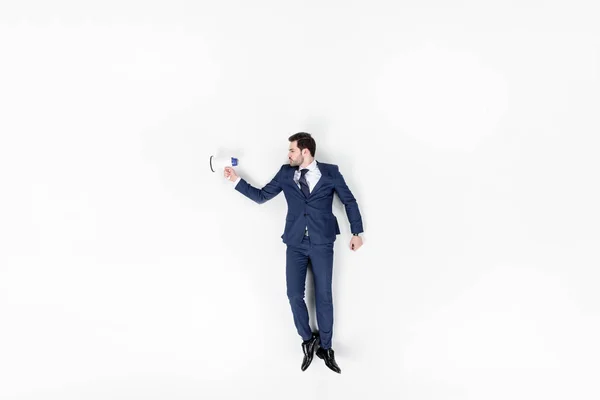 Вид зверху молодого бізнесмена з гучномовцем ізольовані на білому — стокове фото