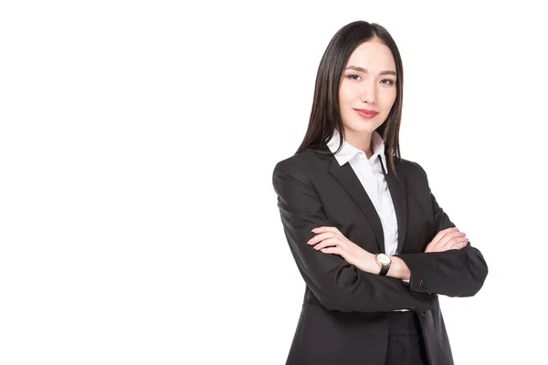 Portrait of smiling asian businesswoman in suit isolated on white — Stock Photo