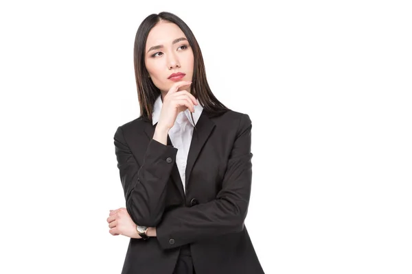 Portrait of pensive asian businesswoman in suit isolated on white — Stock Photo