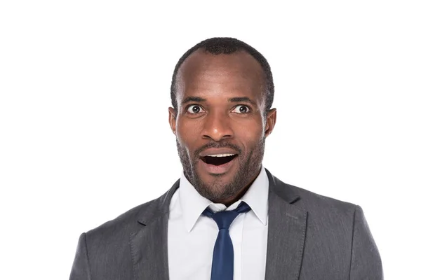 Portrait of excited african american businessman in suit isolated on white — Stock Photo