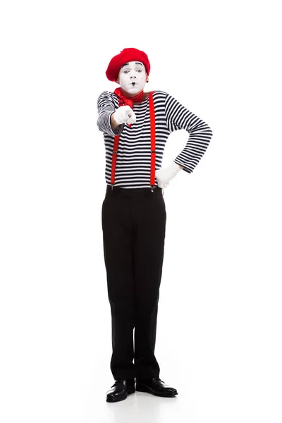 Grimacing mime pointing on camera isolated on white — стоковое фото
