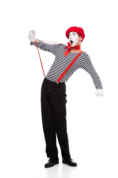 Shocked mime looking at red suspenders isolated on white — Stock Photo