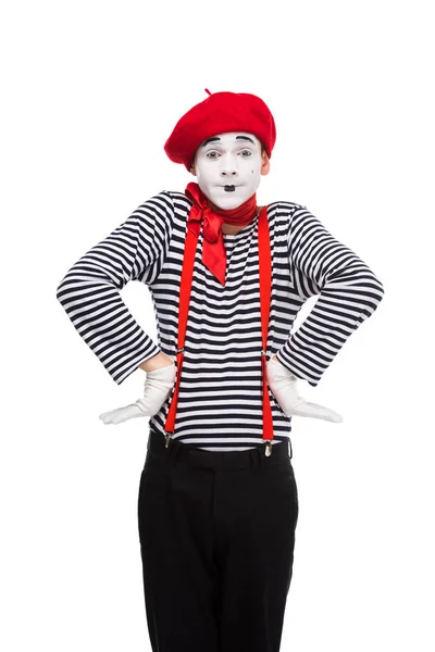 Surprised mime standing with hands akimbo isolated on white — Stock Photo