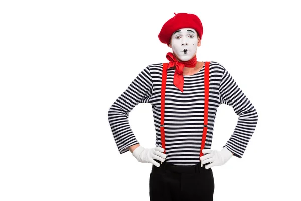 Surprised mime standing with hands akimbo isolated on white — Stock Photo