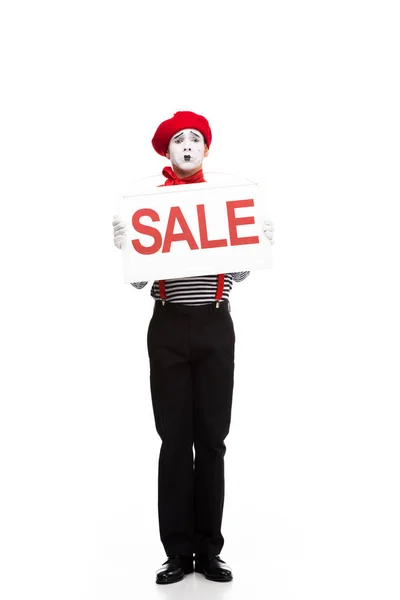 Confused mime holding sale signboard isolated on white — Stock Photo