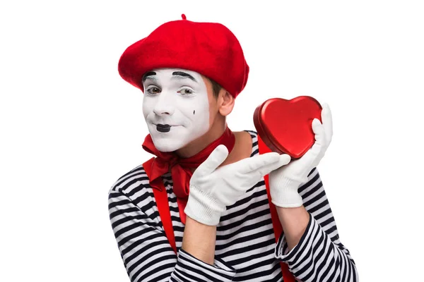 Happy mime showing at heart shaped gift box isolated on white, st valentines day concept — Stock Photo