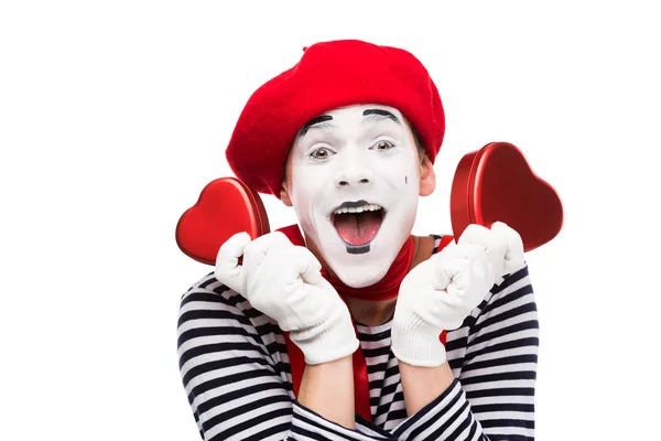 Happy mime holding heart shaped gift boxes isolated on white, st valentines day concept — Stock Photo
