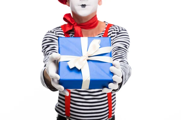 Cropped image of mime showing gift box isolated on white — Stock Photo