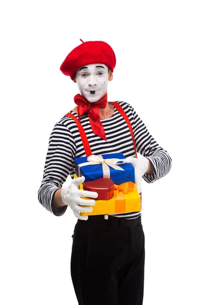 Happy mime holding gift boxes isolated on white — Stock Photo