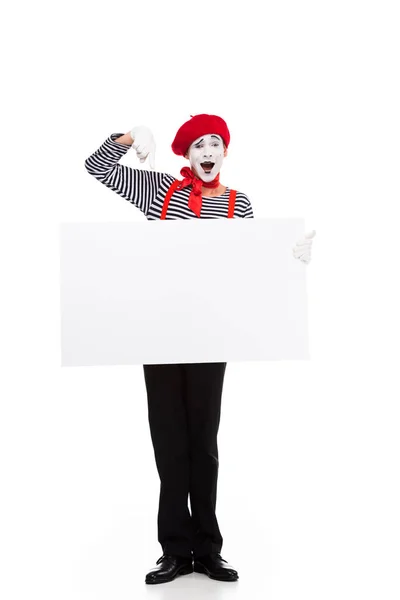 Happy mime pointing on on empty board isolated on white — Stock Photo